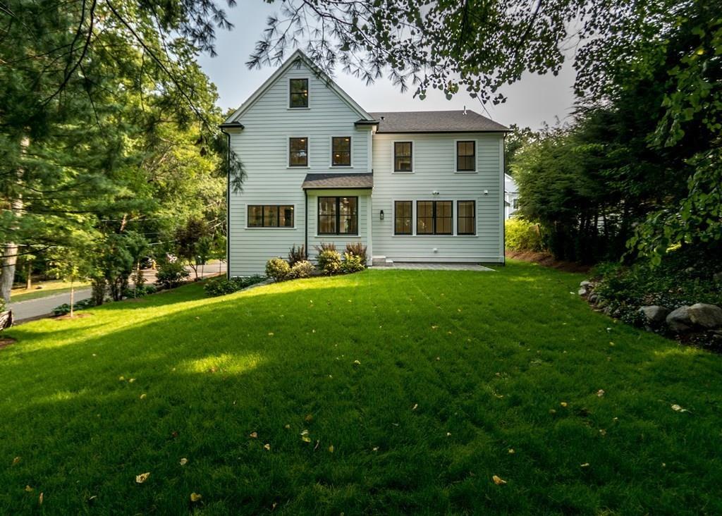 56 Pershing Road Needham, MA 02494 - Photo 40 of 42 a front view of house with yard and green space