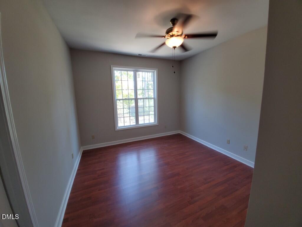 8007 Sundance Circle Durham, NC 27713 - Photo 15 of 23 an empty room with wooden floor and windows