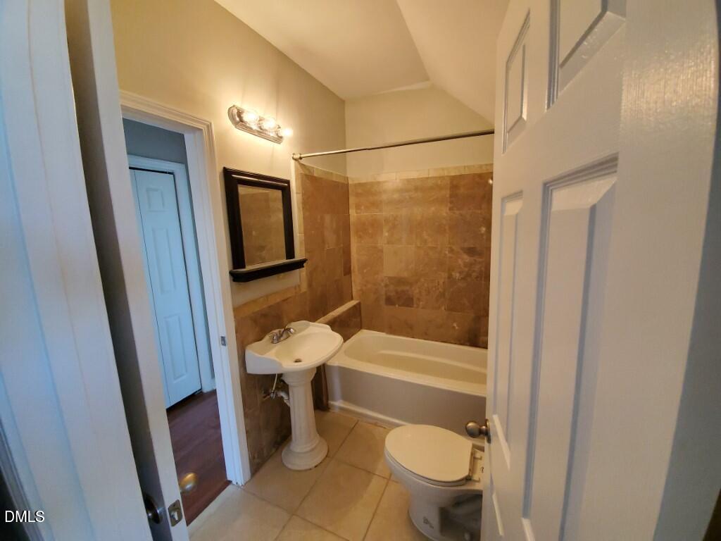 8007 Sundance Circle Durham, NC 27713 - Photo 17 of 23 a bathroom with a sink a toilet a mirror and shower