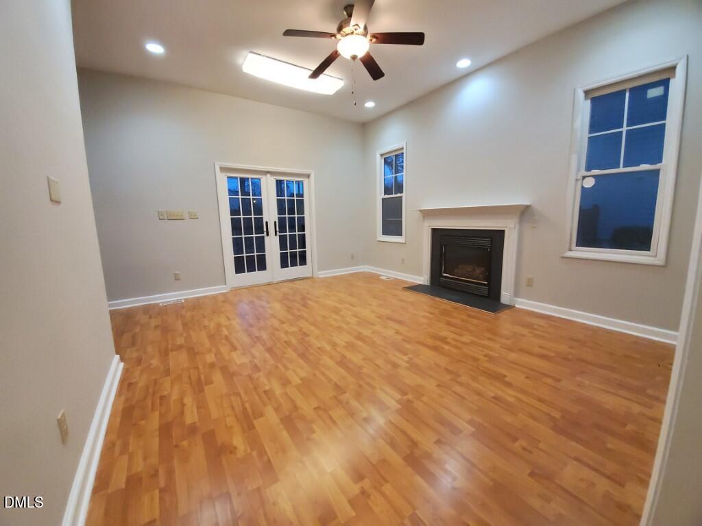 8007 Sundance Circle Durham, NC 27713 - Photo 3 of 23 a view of an empty room with window and fireplace