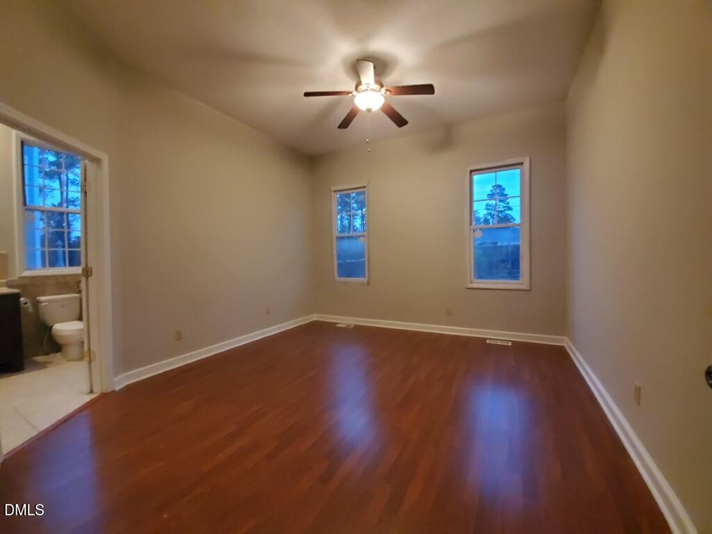 8007 Sundance Circle Durham, NC 27713 - Photo 7 of 23 a view of a livingroom with a ceiling fan and window