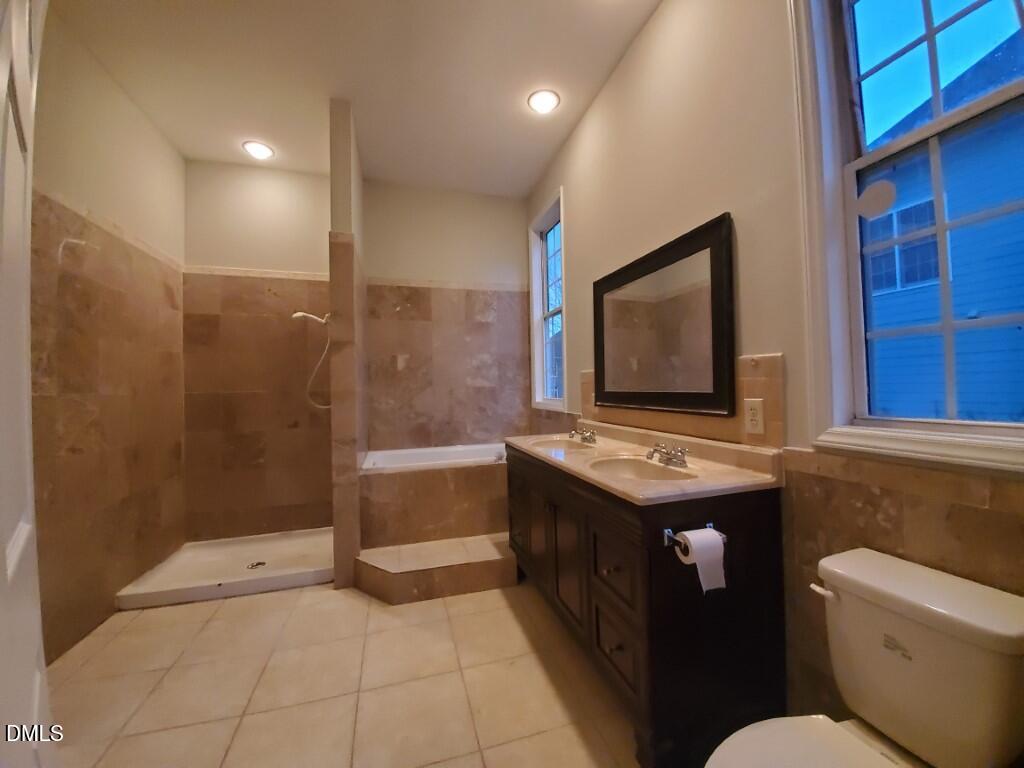 8007 Sundance Circle Durham, NC 27713 - Photo 8 of 23 a bathroom with a sink toilet and shower