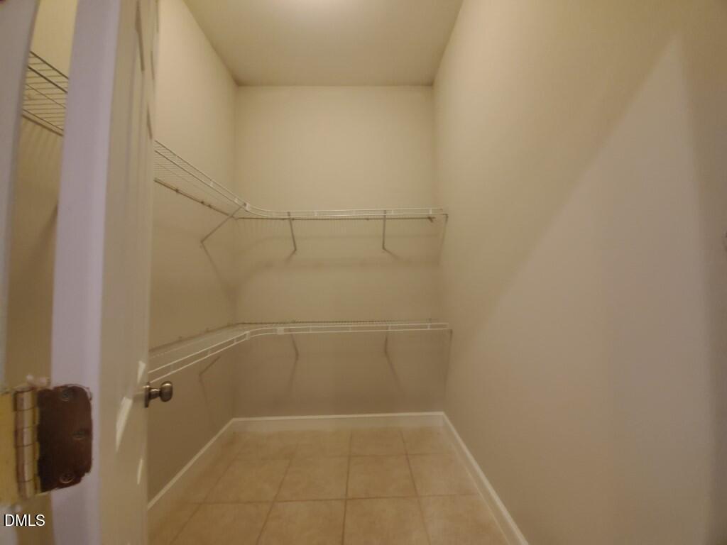 8007 Sundance Circle Durham, NC 27713 - Photo 9 of 23 a bathroom with a glass shower door
