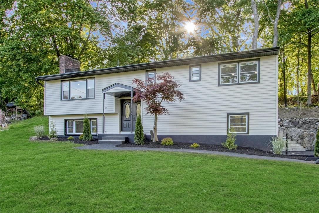 38 Lakes Road Monroe, NY 10950 - Photo 1 of 1 a front view of house with a garden
