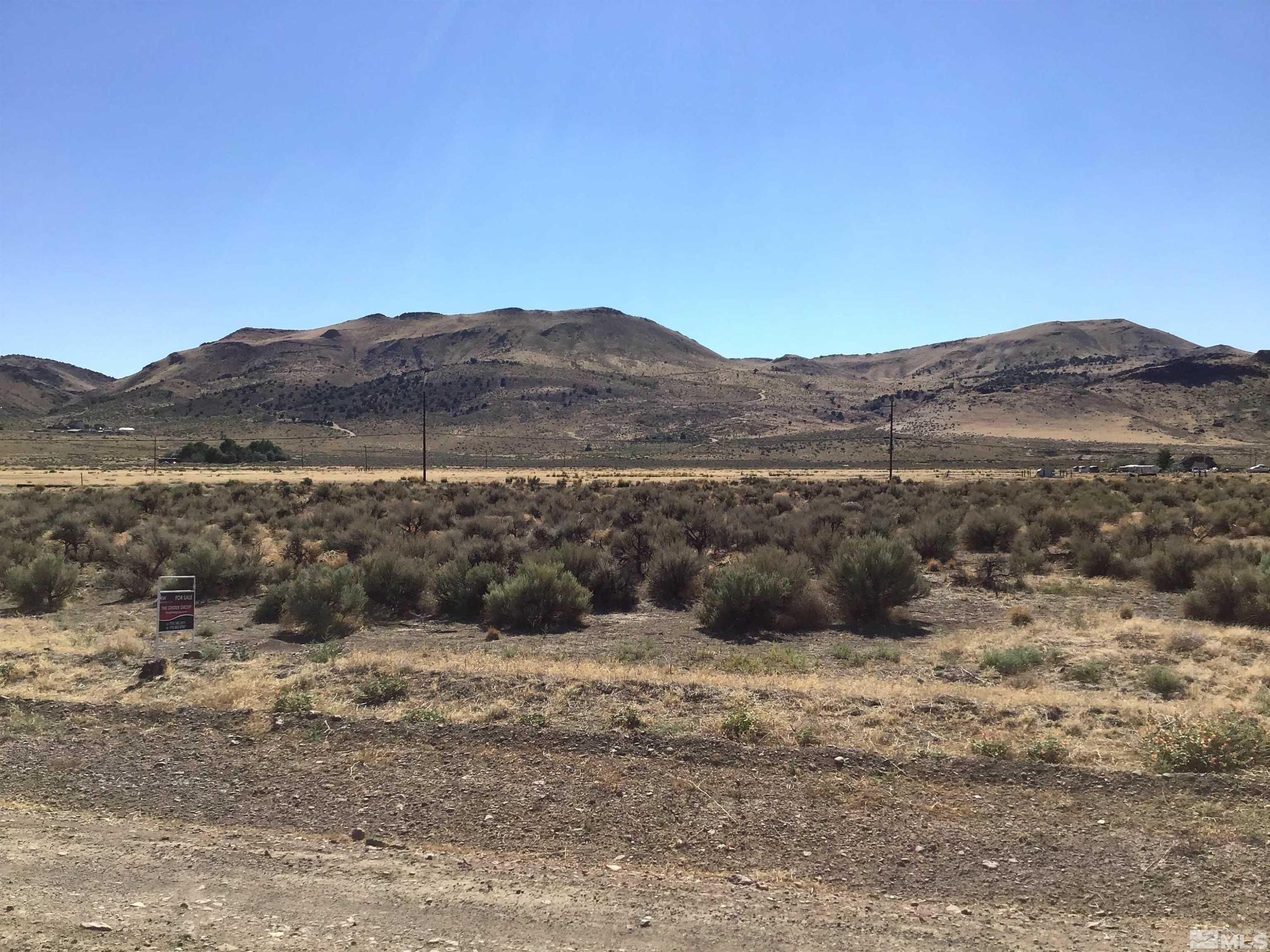 4755 Grass Valley Road Reno, NV 89510 - Photo 7 of 8 a view of a large mountain with mountains in the background