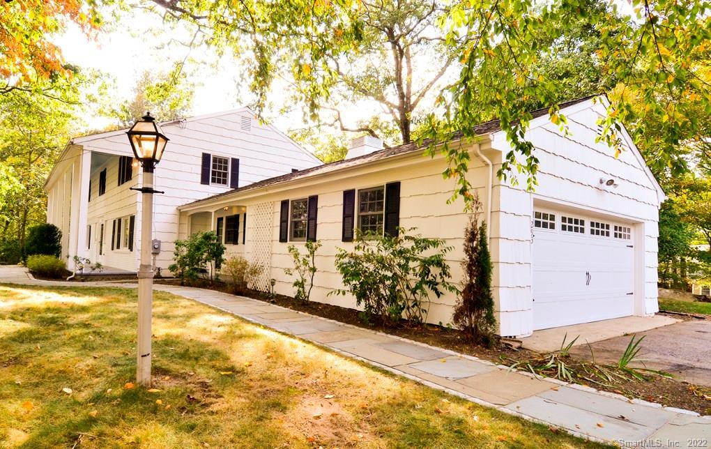293 Dundee Road Stamford, CT 06903 - Photo 1 of 1 a front view of a house with yard