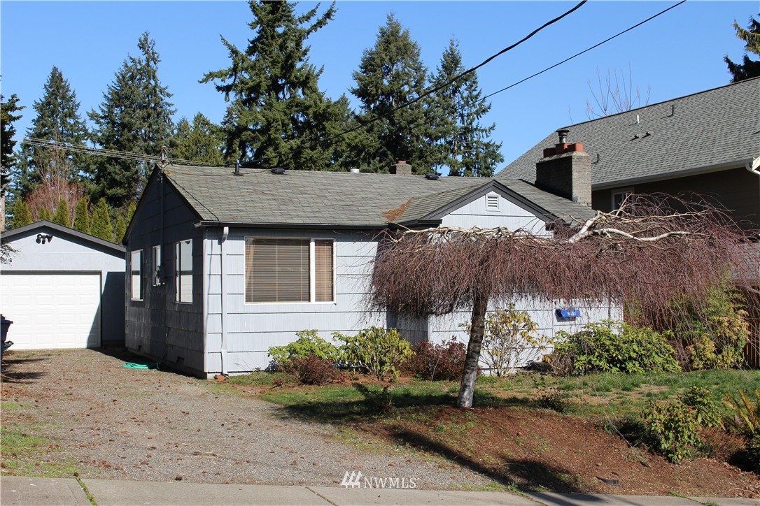 619 Ramsdell Street Fircrest, WA 98466 - Photo 1 of 12 a view of a house with a yard and plants