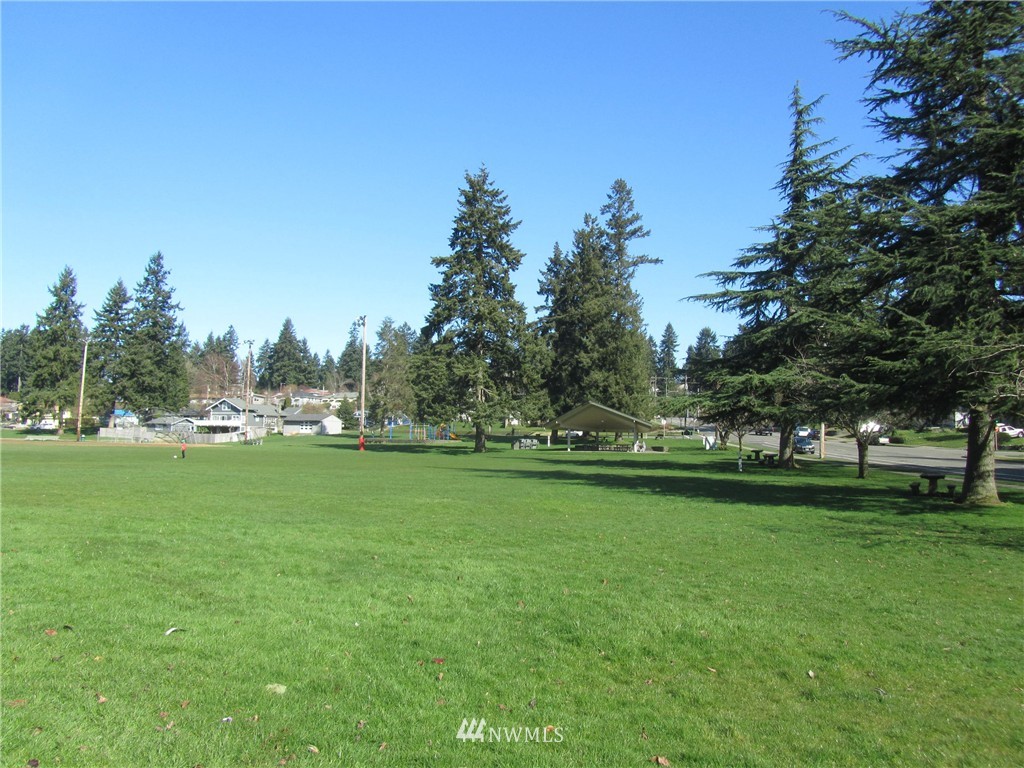 619 Ramsdell Street Fircrest, WA 98466 - Photo 12 of 12 a view of a field of grass and trees