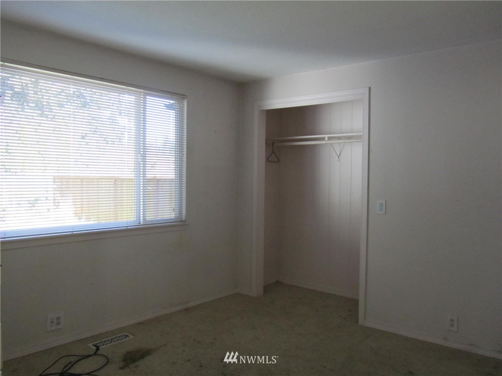 619 Ramsdell Street Fircrest, WA 98466 - Photo 7 of 12 an empty room with a window