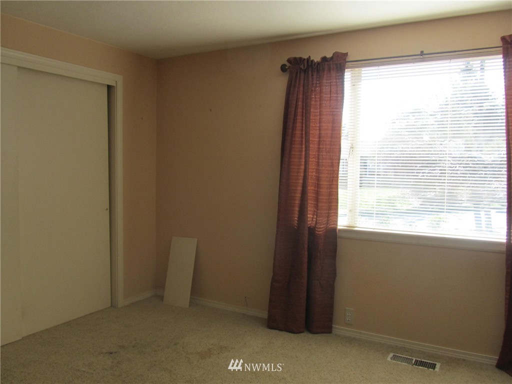 619 Ramsdell Street Fircrest, WA 98466 - Photo 9 of 12 a view of an empty room and window