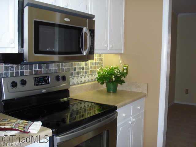 2934 D St Marks Road Southwest Winston-Salem, NC 27103 - Photo 2 of 9 Other. Kitchen Has New Flooring, Microwave, Range/Oven & Light Fixture.