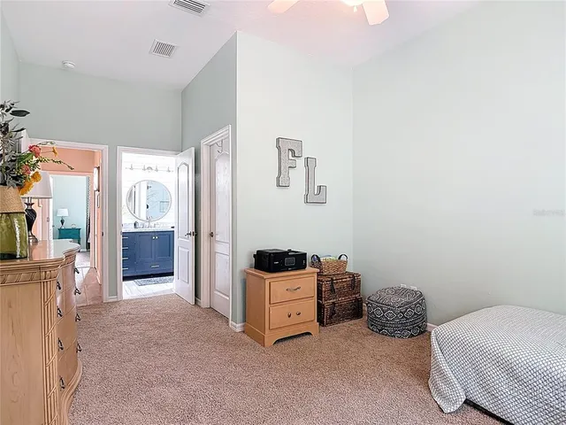 a bedroom with a bed and cabinets