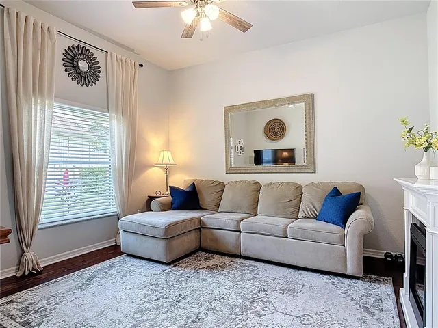 a living room with furniture and a window