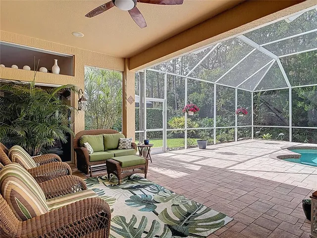 a view of a livingroom with couch and deck