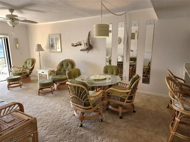 a dining room with furniture and wooden floor