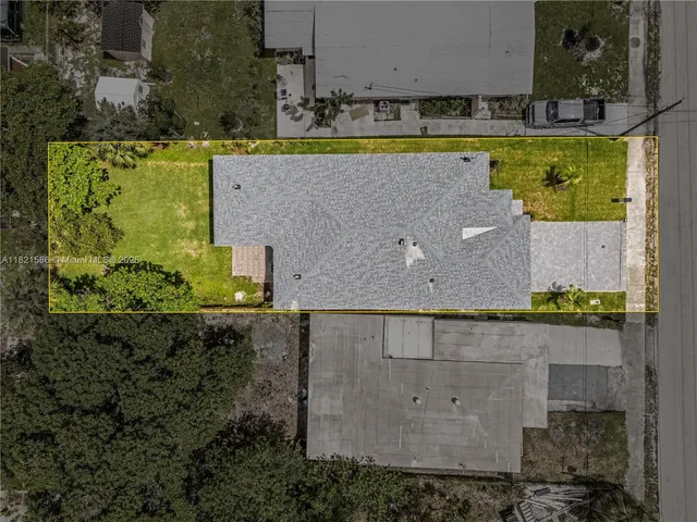 an aerial view of residential building and lake