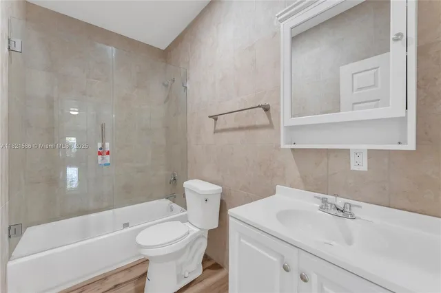 an aerial view of a house with a swimming pool