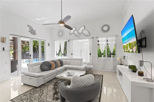 a bedroom with a bed and ceiling fan