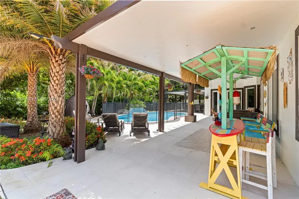 a view of a chairs and tables in the patio