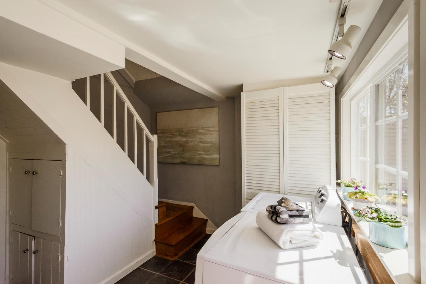 117 Dwight Road Burlingame, CA 94010 - Photo 17 of 20 a bedroom with a bed and a large window with wooden floor