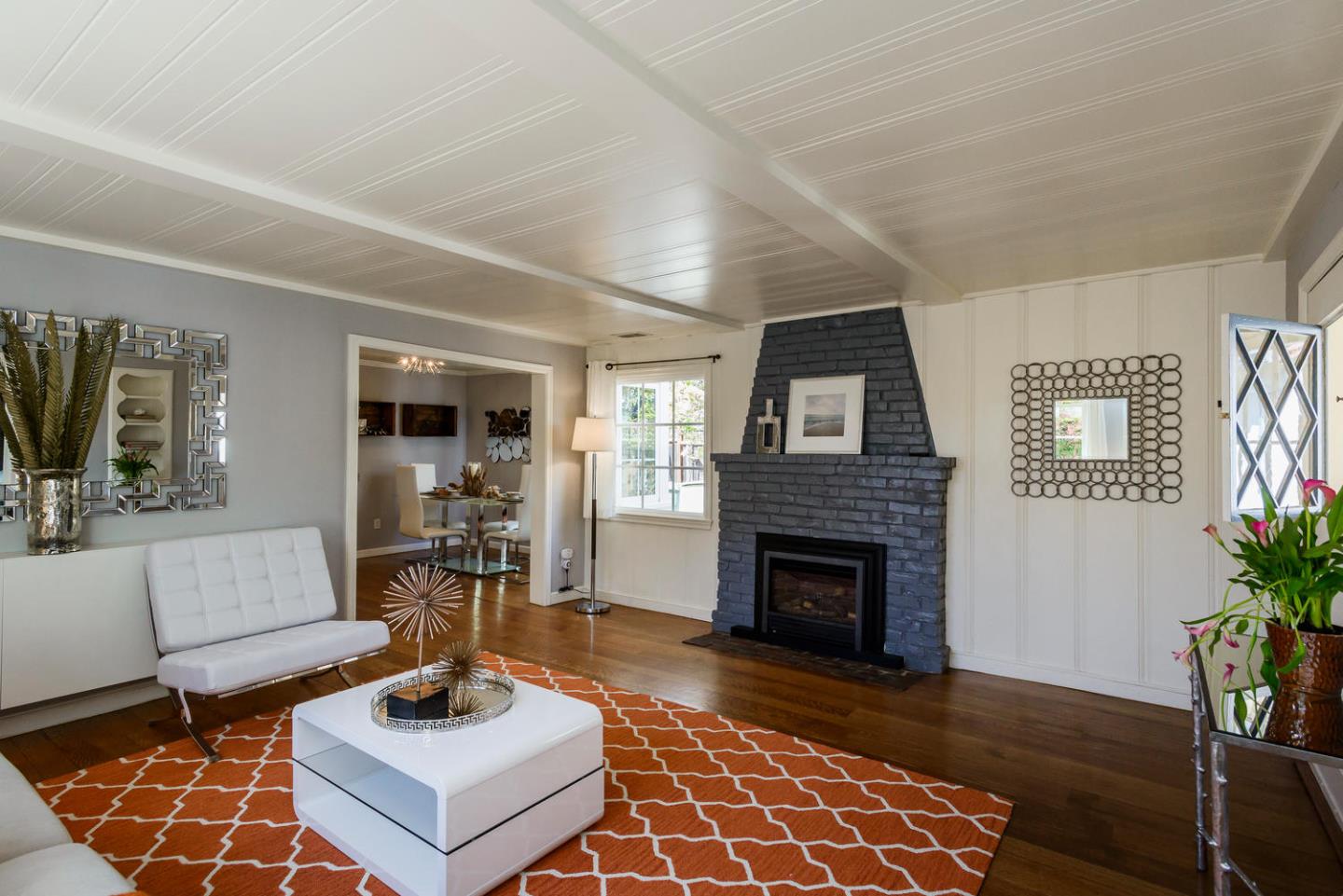 117 Dwight Road Burlingame, CA 94010 - Photo 6 of 20 a living room with furniture a fireplace and a potted plant
