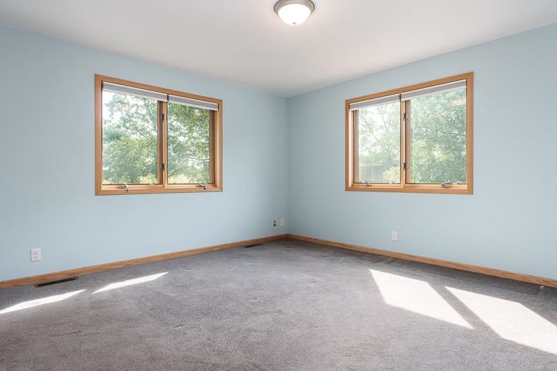 4585 South Chana Road Chana, IL 61015 - Photo 21 of 76 a view of an empty room with a window