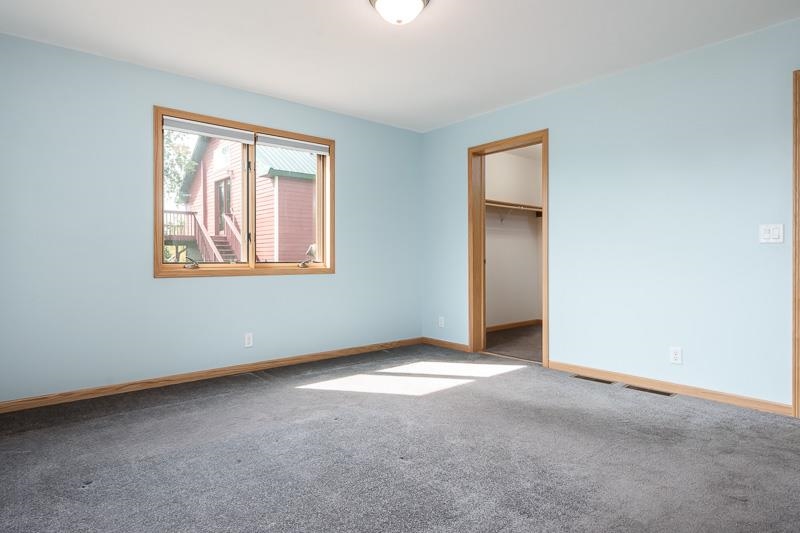 4585 South Chana Road Chana, IL 61015 - Photo 22 of 76 an empty room with windows