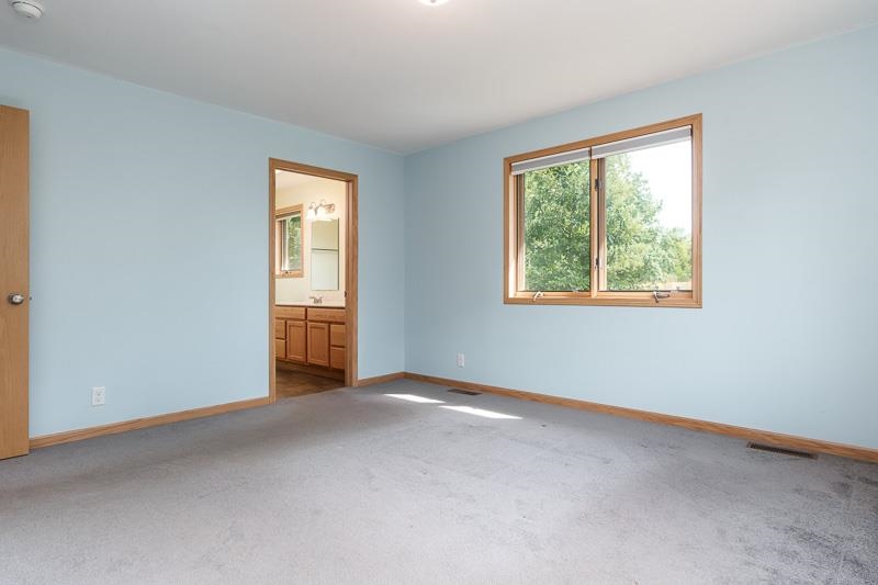 4585 South Chana Road Chana, IL 61015 - Photo 23 of 76 an empty room with windows