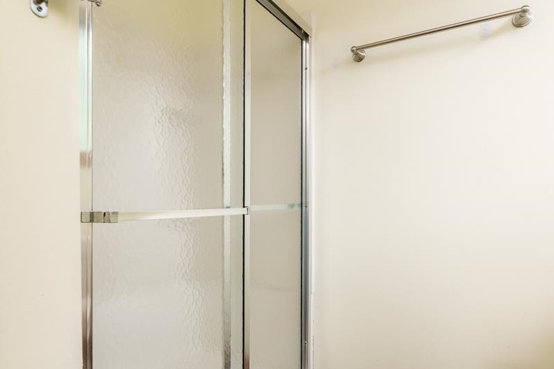 4585 South Chana Road Chana, IL 61015 - Photo 26 of 76 a bathroom with a glass shower door