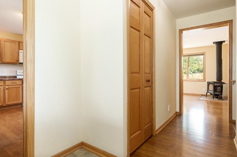 4585 South Chana Road Chana, IL 61015 - Photo 4 of 76 a view of a hallway with wooden floor