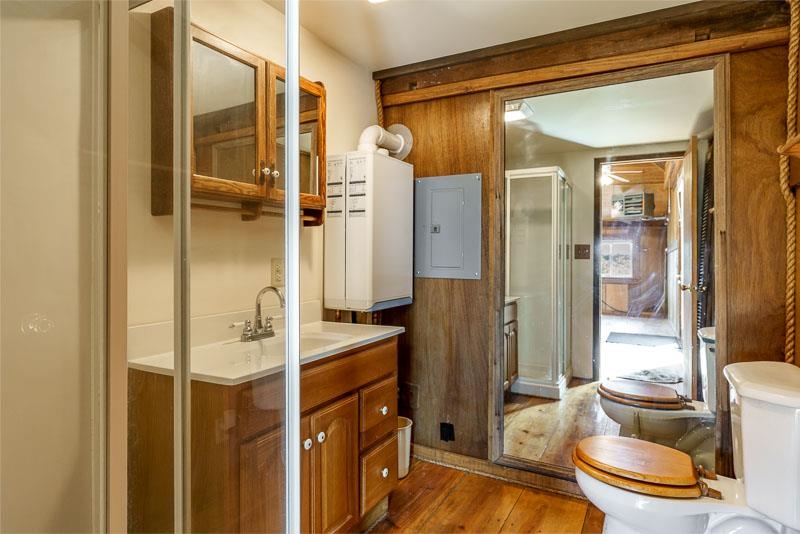4585 South Chana Road Chana, IL 61015 - Photo 48 of 76 a bathroom with a shower and a toilet