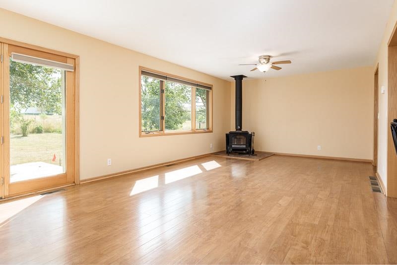 4585 South Chana Road Chana, IL 61015 - Photo 9 of 76 a view of a room with wooden floor and windows
