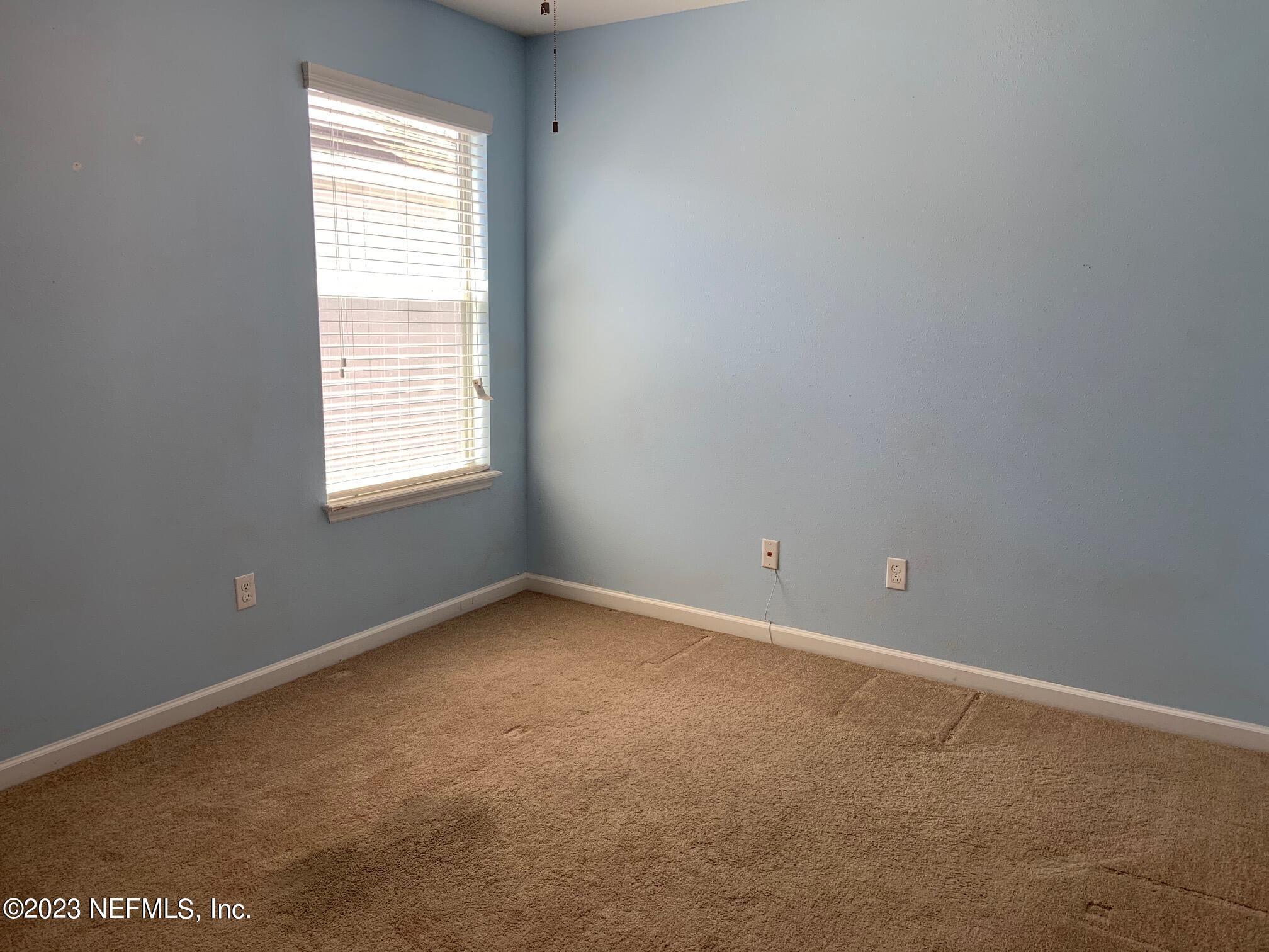3863 Chasing Falls Road Orange Park, FL 32065 - Photo 27 of 32 an empty room with a window