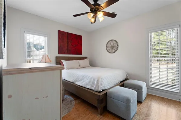 a bedroom with furniture and a window