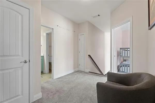 a living room with furniture and a ceiling fan