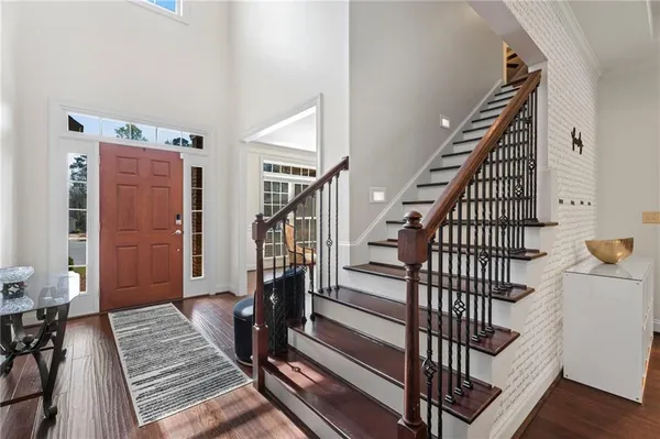 a view of entryway with wooden floor