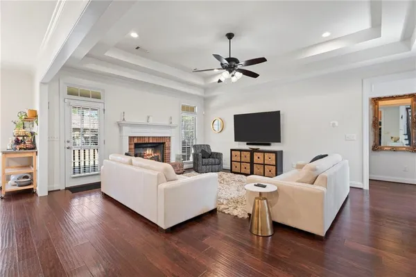 a living room with furniture fireplace and flat screen tv