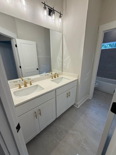 5648 Meadow View Drive Jefferson, GA 30549 - Photo 19 of 31 a bathroom with a double vanity sink and mirror