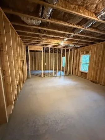 a view of an empty room with wooden walls