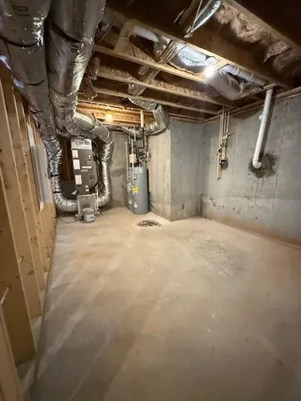 a view of empty room with wooden walls
