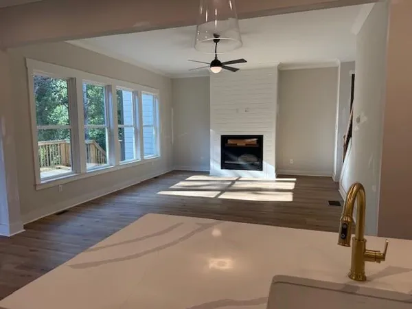 a view of livingroom with furniture and chandelier fan