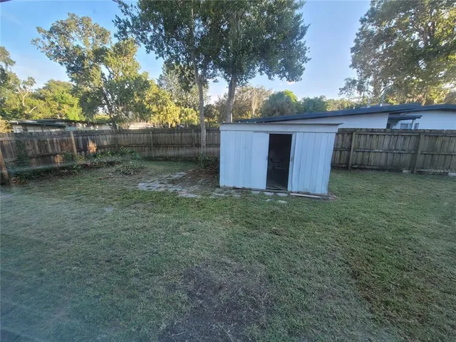 a backyard of a house with lots of green space
