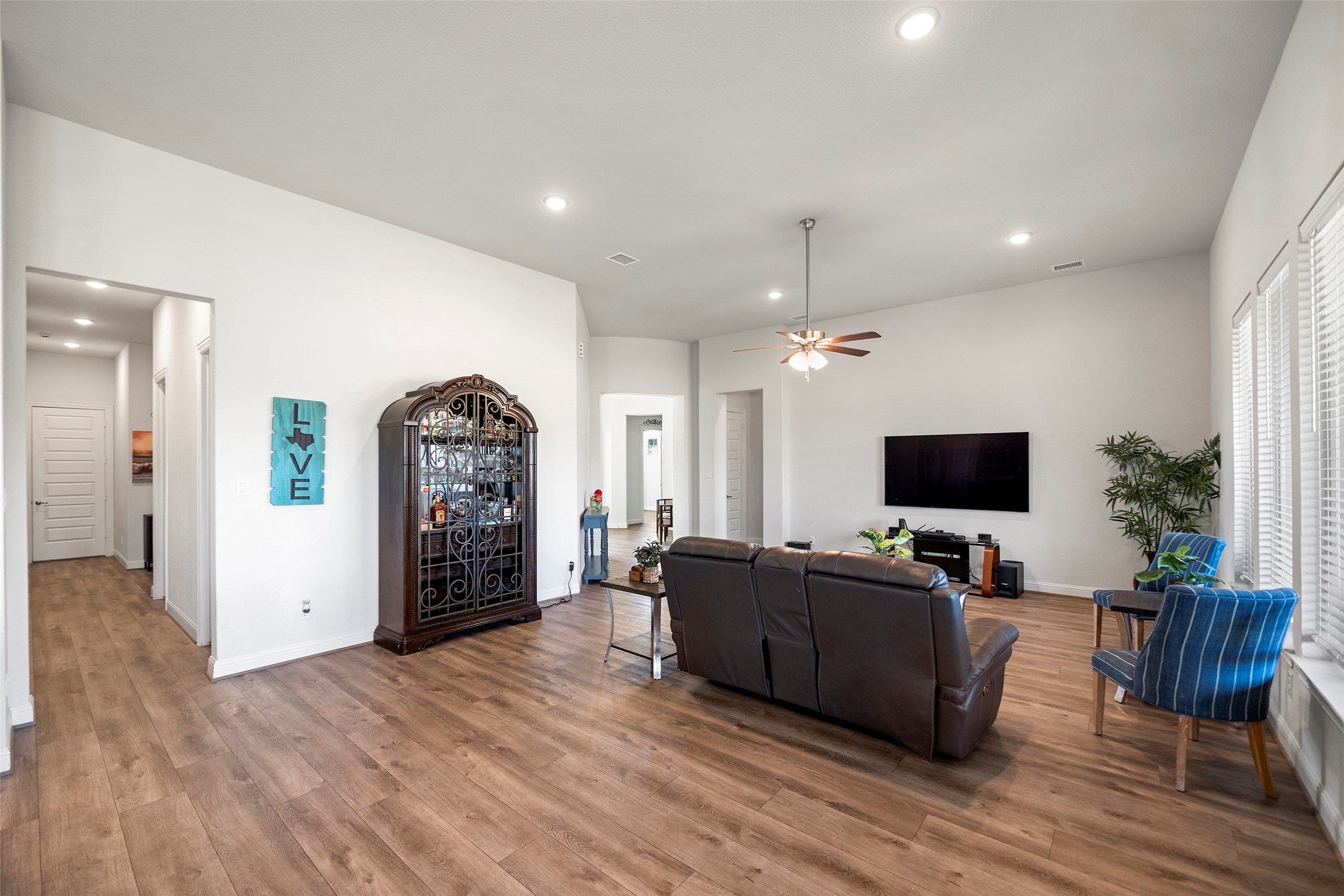 41015 Kimber Lane Magnolia, TX 77354 - Photo 16 of 44 a living room with furniture and a flat screen tv