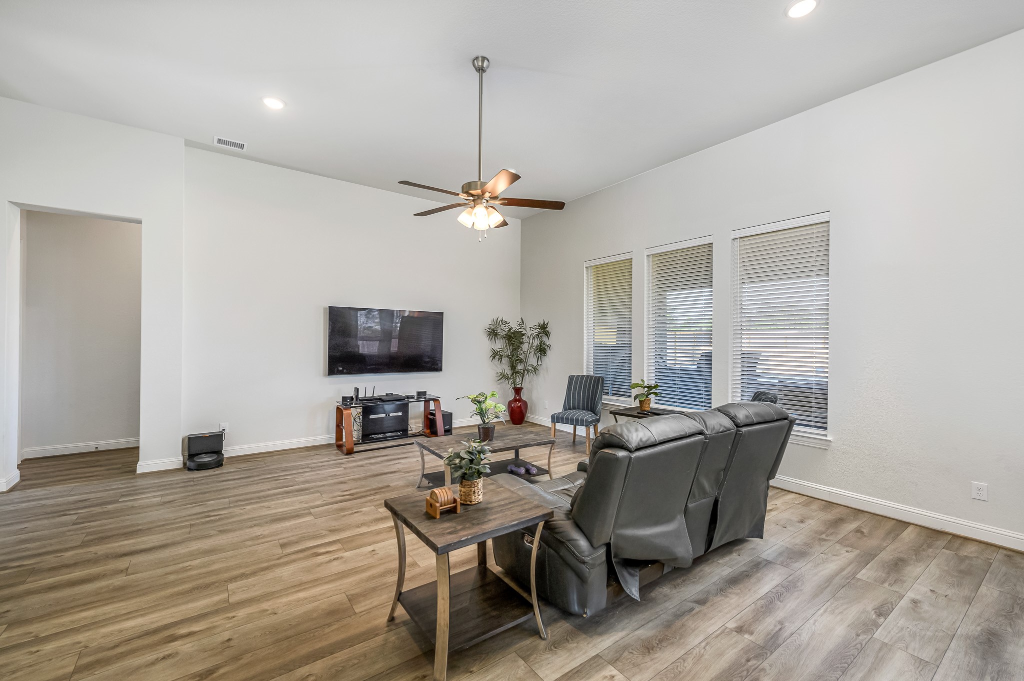 41015 Kimber Lane Magnolia, TX 77354 - Photo 17 of 44 a view of a dining room with furniture window and wooden floor