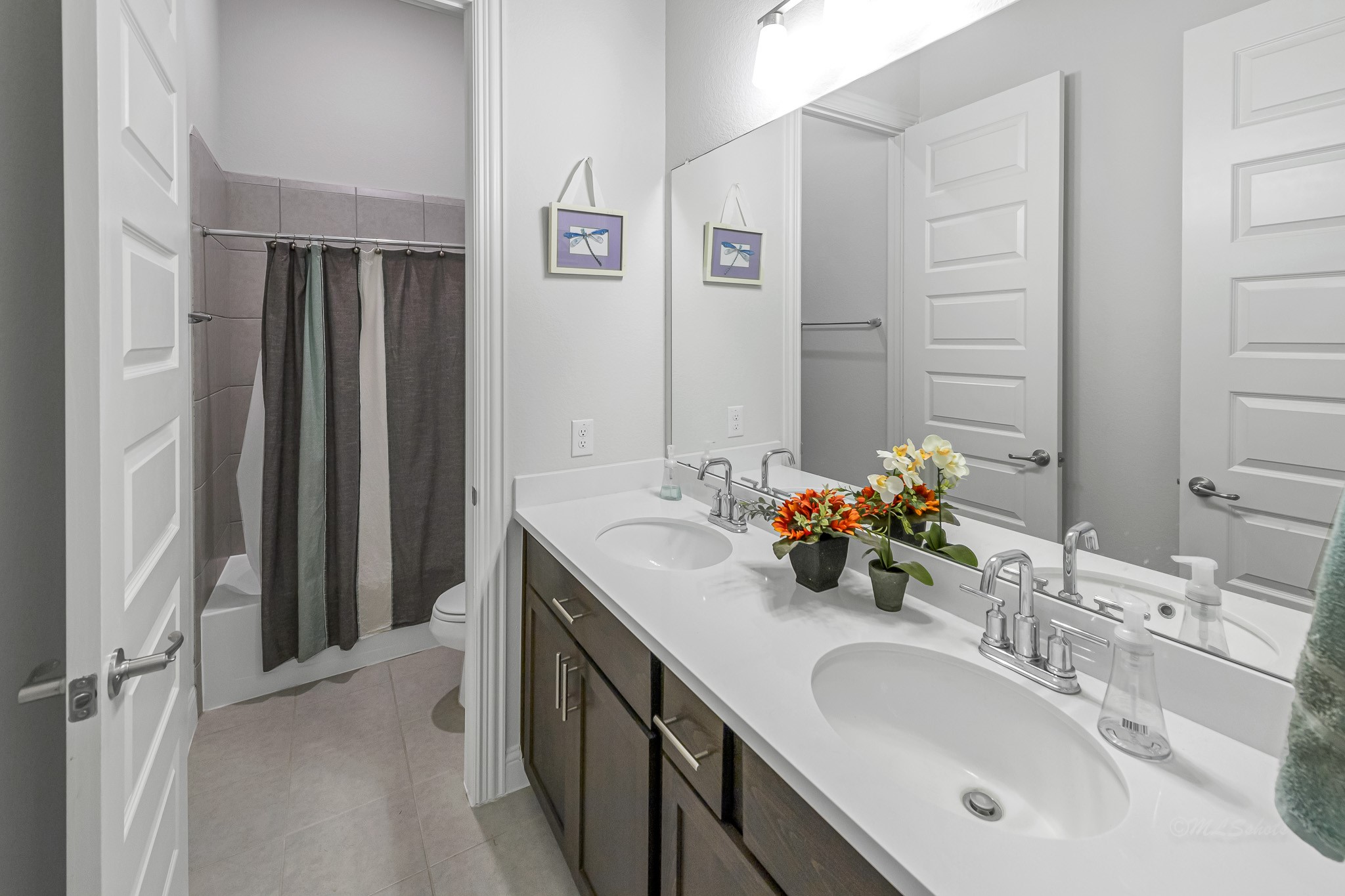 41015 Kimber Lane Magnolia, TX 77354 - Photo 29 of 44 a bathroom with a double vanity sink and a mirror