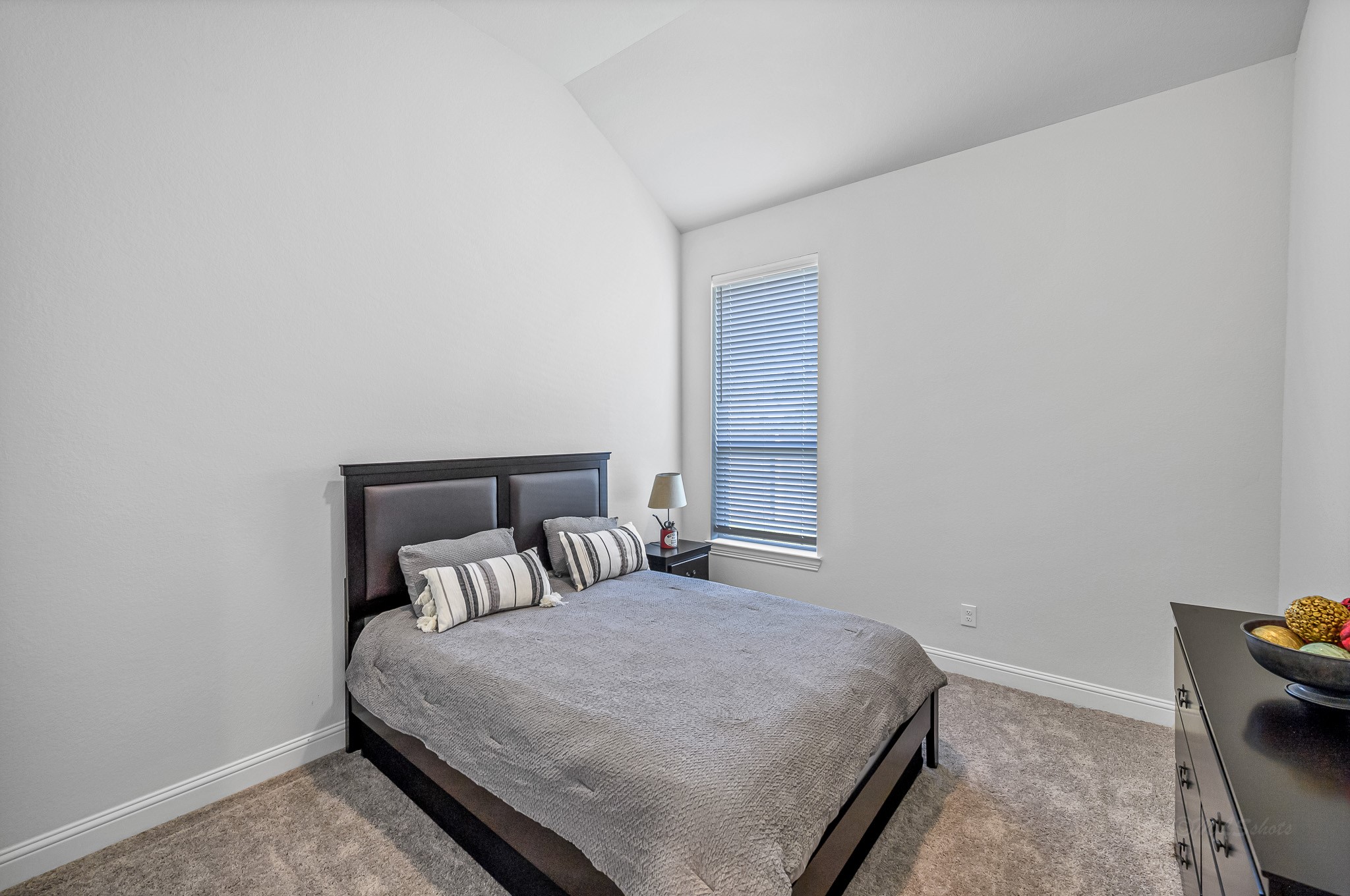 41015 Kimber Lane Magnolia, TX 77354 - Photo 30 of 44 a bedroom with a bed and chair