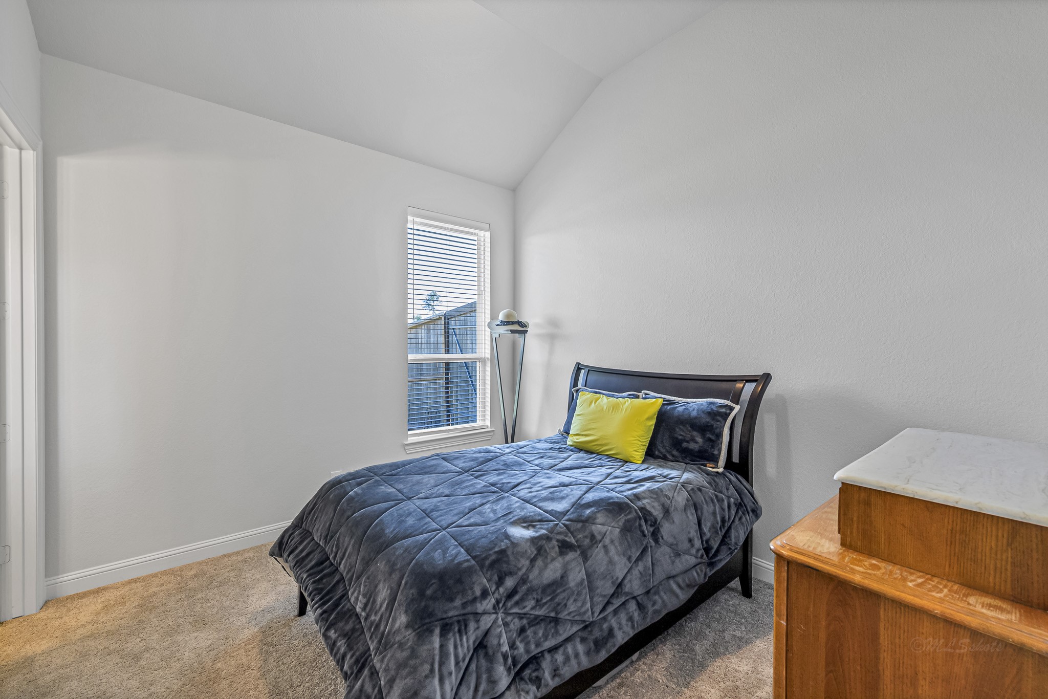 41015 Kimber Lane Magnolia, TX 77354 - Photo 31 of 44 a bedroom with a bed and blue cabinets