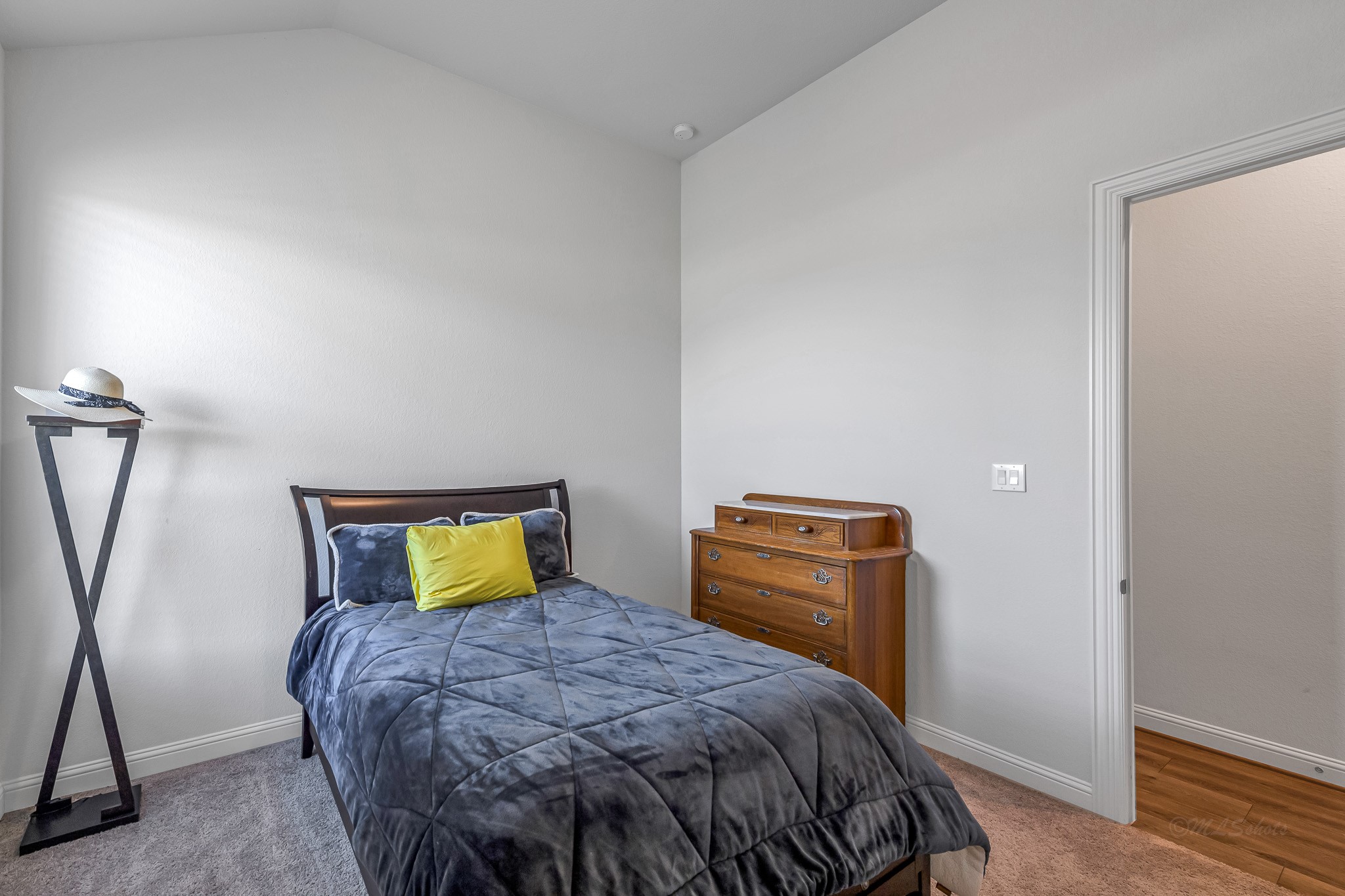 41015 Kimber Lane Magnolia, TX 77354 - Photo 33 of 44 a bedroom with a bed and wooden floor