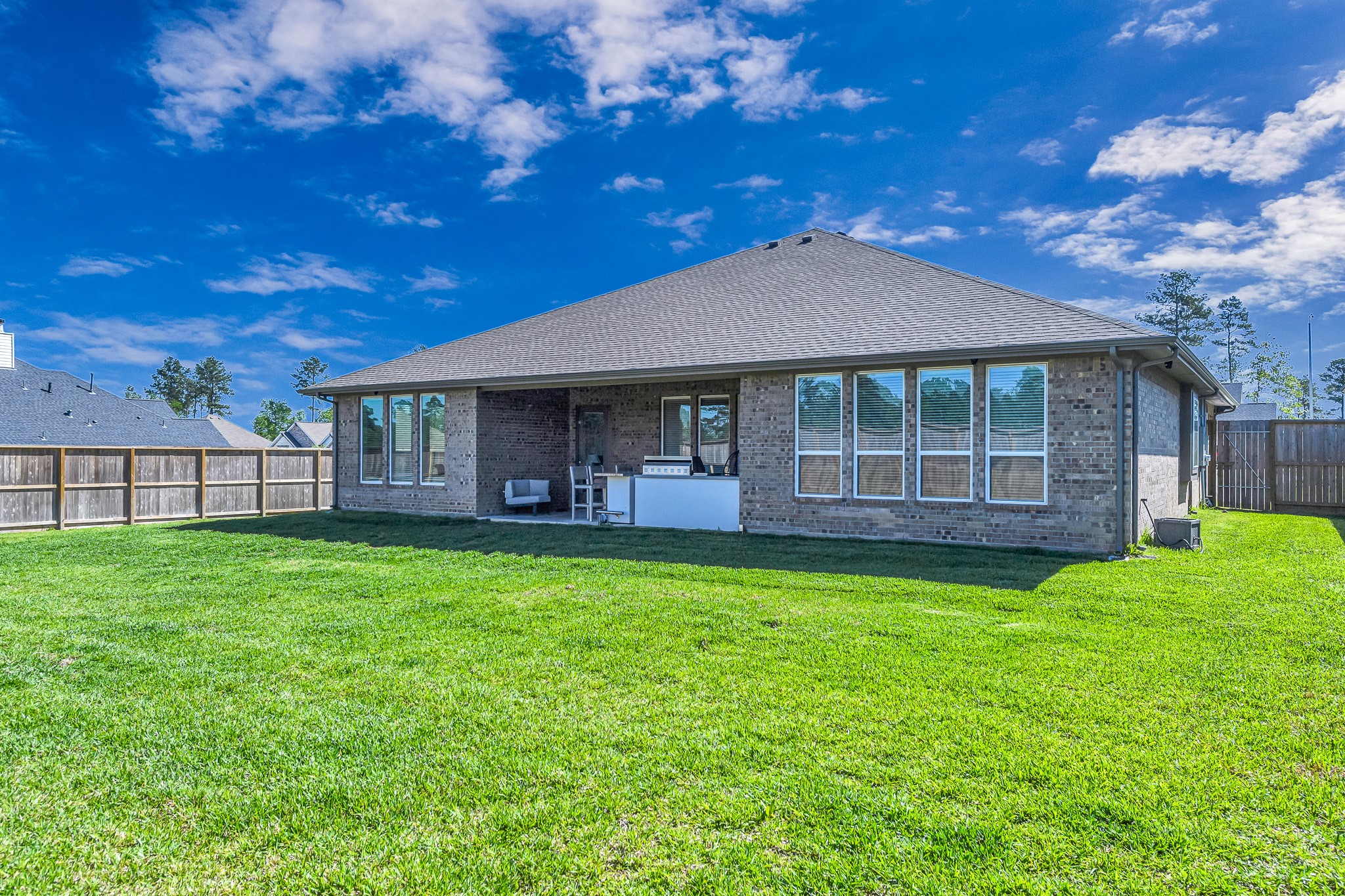41015 Kimber Lane Magnolia, TX 77354 - Photo 38 of 44 a view of a house with a yard