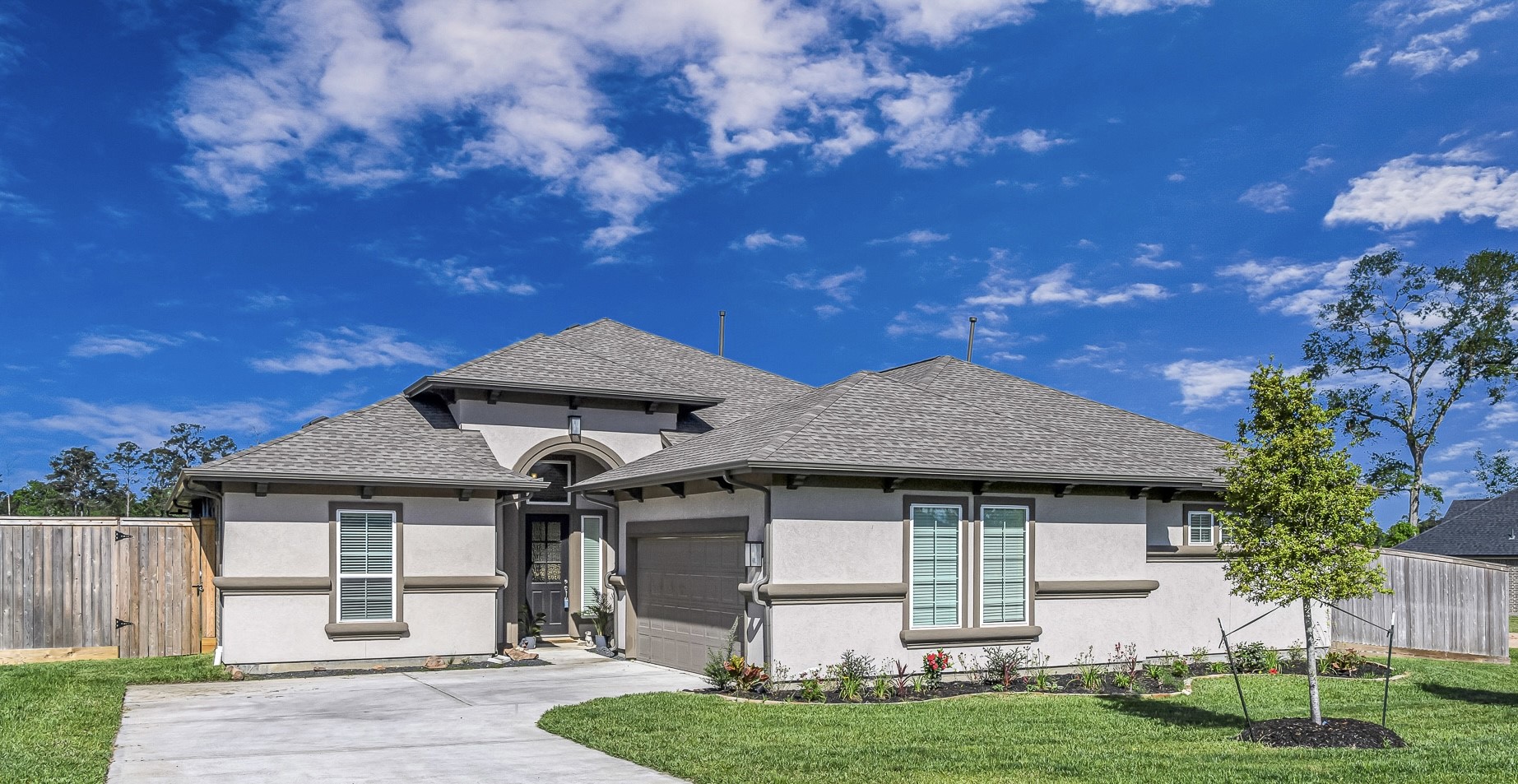 41015 Kimber Lane Magnolia, TX 77354 - Photo 9 of 44 a front view of a house with a yard